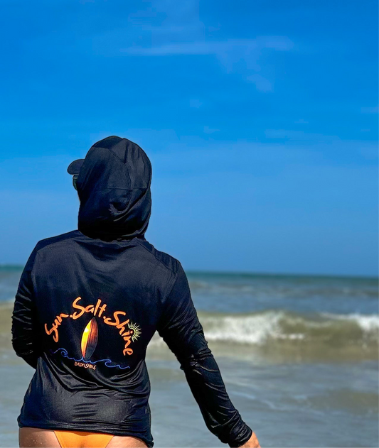 Adult wearing Sun Salt Shine UPF 50+ hooded sun shirt, lightweight and breathable beachwear